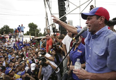 Venezuela's opposition leader and presidential candidate Henrique Capriles (R) speaks to supporters during a rally in Maracaibo March 17, 20 Venezuela's opposition leader and presidential candidate Henrique Capriles (R) speaks to supporters during a rally in Maracaibo March 17, 20