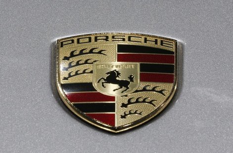 A Porsche logo is seen on a displayed car on media day at the Paris Mondial de l'Automobile September 27, 2012. REUTERS/Christian Hartmann A Porsche logo is seen on a displayed car on media day at the Paris Mondial de l'Automobile September 27, 2012. REUTERS/Christian Hartmann