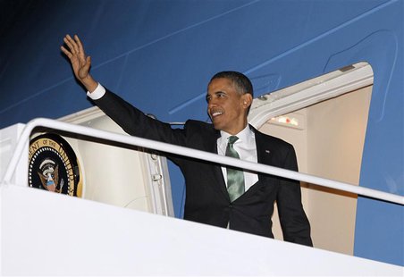 U.S. President Barack Obama waves as he steps aboard Air Force One at Andrews Air Force Base near Washington, March 19, 2013. Obama is trave U.S. President Barack Obama waves as he steps aboard Air Force One at Andrews Air Force Base near Washington, March 19, 2013. Obama is trave