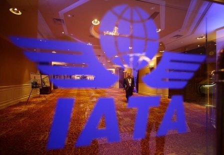 A delegate of the 68th International Air Transport Association (IATA) annual general meeting is pictured through an IATA logo in Beijing Jun A delegate of the 68th International Air Transport Association (IATA) annual general meeting is pictured through an IATA logo in Beijing Jun