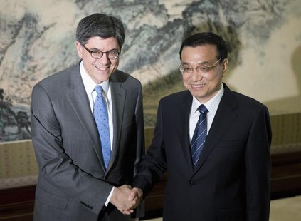 U.S. Treasury Secretary Jacob Lew (L) and Chinese Premier Li Keqiang pose for photographs before adjourning to their meeting at the Zhongnan U.S. Treasury Secretary Jacob Lew (L) and Chinese Premier Li Keqiang pose for photographs before adjourning to their meeting at the Zhongnan