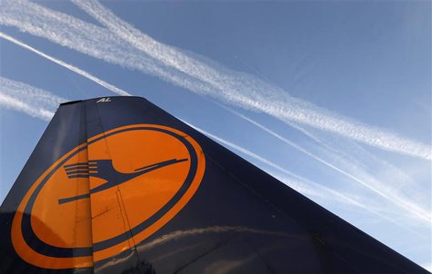 File photo of air planes flying over the Fraport airport, next to a Lufthansa aircraft tail fin, in Frankfurt, September 4, 2012. REUTERS/Ka File photo of air planes flying over the Fraport airport, next to a Lufthansa aircraft tail fin, in Frankfurt, September 4, 2012. REUTERS/Ka