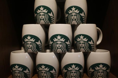 Starbucks coffee mugs are seen on display during the launch of the first Starbucks store in New Delhi, February 6, 2013. REUTERS/Adnan Abidi Starbucks coffee mugs are seen on display during the launch of the first Starbucks store in New Delhi, February 6, 2013. REUTERS/Adnan Abidi