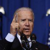 U.S. Vice President Joseph Biden talks before U.S. President Barack Obama signs the Violence Against Women Act while at the Department of In