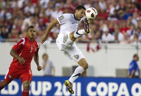 United States' Clint Dempsey takes a shot on goal near Panama's Roman Torres (L) during the first half of their CONCACAF Gold Cup soccer mat United States' Clint Dempsey takes a shot on goal near Panama's Roman Torres (L) during the first half of their CONCACAF Gold Cup soccer mat