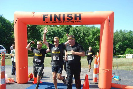 Participants cross the finish line during the 2012 Kalamazoo Mud Run. Participants cross the finish line during the 2012 Kalamazoo Mud Run.