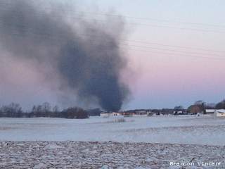 Smoke from a house fire rises over 5028 Dickinson in the town of Ledgeview, March 20, 2013. (courtesy of FOX 11). Smoke from a house fire rises over 5028 Dickinson in the town of Ledgeview, March 20, 2013. (courtesy of FOX 11).