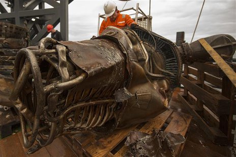 A heat exchanger from an Apollo F-1 engine is seen in this handout photo from Bezos Expeditions taken onboard a recovery ship off the coast A heat exchanger from an Apollo F-1 engine is seen in this handout photo from Bezos Expeditions taken onboard a recovery ship off the coast