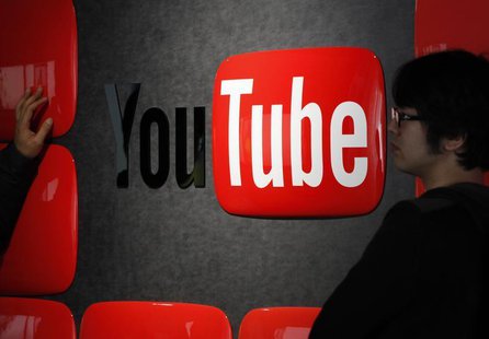 Visitors stand in front of a logo of YouTube at the YouTube Space Tokyo, operated by Google, in Tokyo February 14, 2013. REUTERS/Shohei Miya Visitors stand in front of a logo of YouTube at the YouTube Space Tokyo, operated by Google, in Tokyo February 14, 2013. REUTERS/Shohei Miya