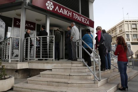 People queue up to make a transaction at an ATM outside a branch of Laiki Bank in Nicosia March 21, 2013. REUTERS/Yorgos Karahalis People queue up to make a transaction at an ATM outside a branch of Laiki Bank in Nicosia March 21, 2013. REUTERS/Yorgos Karahalis