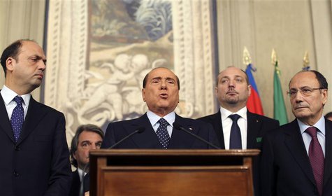 Italy's former Prime Minister Silvio Berlusconi (C) speaks after meeting with Italian President Giorgio Napolitano at Quirinale palace in Ro Italy's former Prime Minister Silvio Berlusconi (C) speaks after meeting with Italian President Giorgio Napolitano at Quirinale palace in Ro