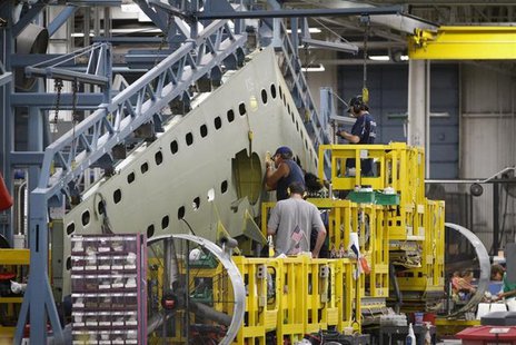 Cessna employees work on a tail section during a tour of the Cessna business jet assembly line at their manufacturing plant in Wichita, Kans Cessna employees work on a tail section during a tour of the Cessna business jet assembly line at their manufacturing plant in Wichita, Kans
