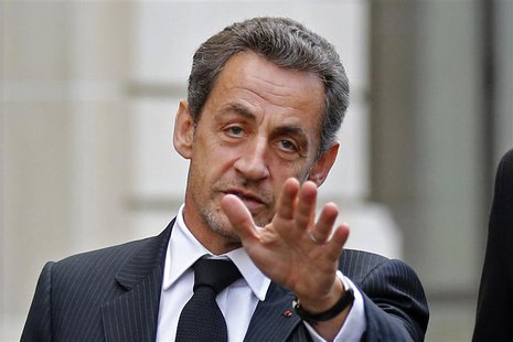 Former French President Nicolas Sarkozy reacts as he leaves his car in Paris November 26, 2012 after a lunch meeting with his former Prime M Former French President Nicolas Sarkozy reacts as he leaves his car in Paris November 26, 2012 after a lunch meeting with his former Prime M