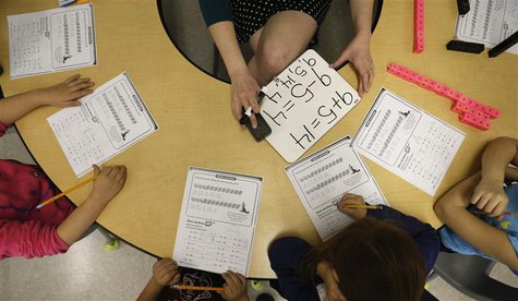 Teacher Jenna Rosenberg speaks to her first grade class at Walsh Elementary School in Chicago, Illinois, March 1, 2013. REUTERS/Jim Young Teacher Jenna Rosenberg speaks to her first grade class at Walsh Elementary School in Chicago, Illinois, March 1, 2013. REUTERS/Jim Young