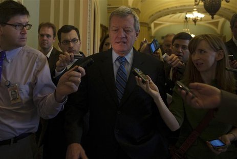 Sen. Max Baucus, (D-MT) is questioned by media at the U.S. Capitol in Washington December 31, 2012. REUTERS/Mary F. Calvert Sen. Max Baucus, (D-MT) is questioned by media at the U.S. Capitol in Washington December 31, 2012. REUTERS/Mary F. Calvert