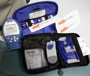A diabetic patient displays her insulin supplies and blood sugar level-testing device at the J.W.C.H. safety-net clinic in the center of ski A diabetic patient displays her insulin supplies and blood sugar level-testing device at the J.W.C.H. safety-net clinic in the center of ski