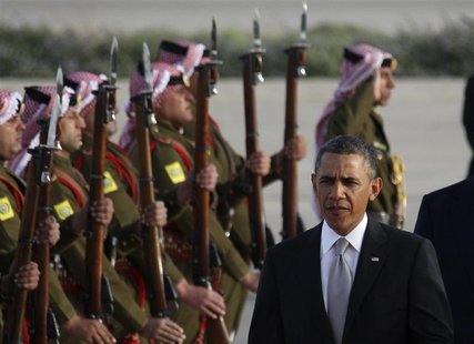 U.S. President Barack Obama is greeted by Bedouin Jordanian honour guards upon his arrival at Amman airport, March 22, 2013. REUTERS/Ali Jar U.S. President Barack Obama is greeted by Bedouin Jordanian honour guards upon his arrival at Amman airport, March 22, 2013. REUTERS/Ali Jar