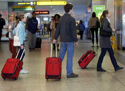 People check flight times on a schedule board at LaGuardia Airport in New York November 21, 2012. REUTERS/Shannon Stapleton People check flight times on a schedule board at LaGuardia Airport in New York November 21, 2012. REUTERS/Shannon Stapleton