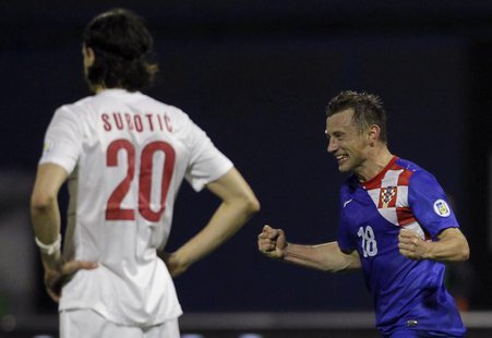 Croatia's Ivica Olic (R) celebrates after scoring against Serbia during their 2014 World Cup qualifying soccer match at Maksimir stadium in Croatia's Ivica Olic (R) celebrates after scoring against Serbia during their 2014 World Cup qualifying soccer match at Maksimir stadium in