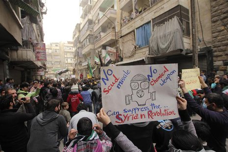 A girl holds a banner during a protest against Syria's President Bashar al-Assad in Bustan al-Qasr district in Aleppo, March 22, 2013. REUTE A girl holds a banner during a protest against Syria's President Bashar al-Assad in Bustan al-Qasr district in Aleppo, March 22, 2013. REUTE
