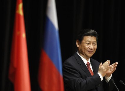 Chinese President Xi Jinping claps during his address to students at the Moscow State Institute of International Relations in Moscow March 2 Chinese President Xi Jinping claps during his address to students at the Moscow State Institute of International Relations in Moscow March 2