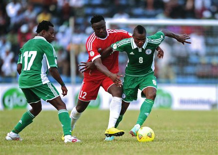 Kenya's Victor Wanyama (C) challenges Nigeria's Brown Ideye (R) during their 2014 World Cup qualifying soccer match at the U.J Esuene Stadiu Kenya's Victor Wanyama (C) challenges Nigeria's Brown Ideye (R) during their 2014 World Cup qualifying soccer match at the U.J Esuene Stadiu