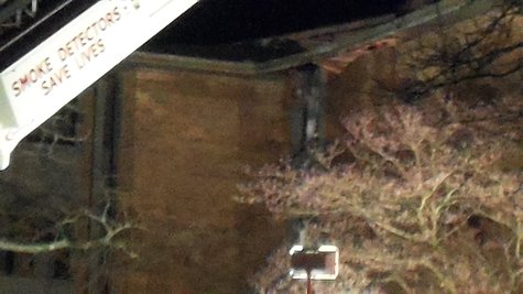 Fire fighters were throwing debris from a window at what seemed to be the part of te building that suffered the worst damage. Fire fighters were throwing debris from a window at what seemed to be the part of te building that suffered the worst damage.