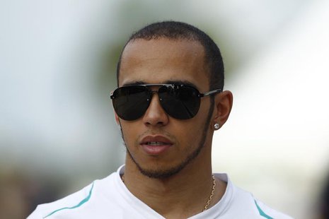 Mercedes Formula One driver Lewis Hamilton of Britain walks after the second practice session of the Malaysian F1 Grand Prix at Sepang Inter Mercedes Formula One driver Lewis Hamilton of Britain walks after the second practice session of the Malaysian F1 Grand Prix at Sepang Inter