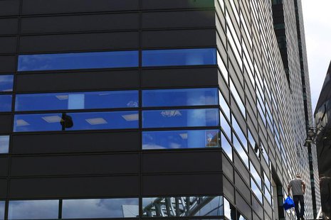 An office worker climbs steps beside a new office development on the waterfront in Oslo, Norway June 20, 2012. REUTERS/Cathal McNaughton An office worker climbs steps beside a new office development on the waterfront in Oslo, Norway June 20, 2012. REUTERS/Cathal McNaughton