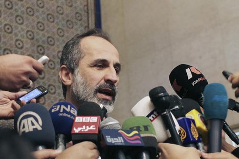 Syrian National Coalition leader Moaz Alkhatib speaks to the media after meeting with Arab League head Nabil al-Arabi in Cairo February 11, Syrian National Coalition leader Moaz Alkhatib speaks to the media after meeting with Arab League head Nabil al-Arabi in Cairo February 11,