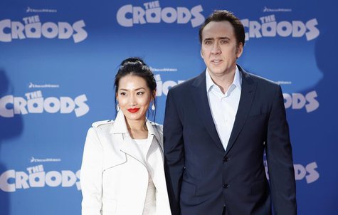 Cast member Nicolas Cage and wife Alice Kim (L) arrive for the premiere of the film "The Croods" in New York, March 10, 2013. REUTERS/Carlo Cast member Nicolas Cage and wife Alice Kim (L) arrive for the premiere of the film "The Croods" in New York, March 10, 2013. REUTERS/Carlo