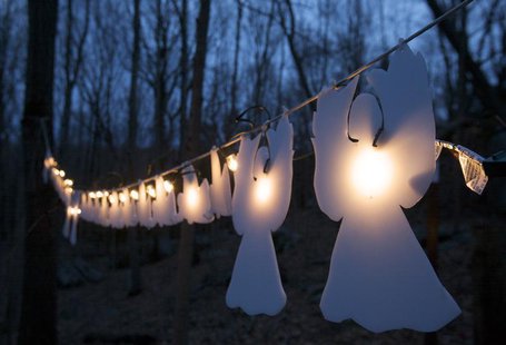 Lighted angels hang from a tree in Monroe, Connecticut January 14, 2013, on the one-month anniversary of the shooting at Sandy Hook elementa Lighted angels hang from a tree in Monroe, Connecticut January 14, 2013, on the one-month anniversary of the shooting at Sandy Hook elementa
