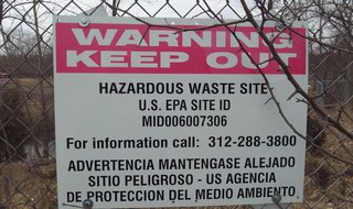 The area remains fenced off to the public with warnings to stay out. The area remains fenced off to the public with warnings to stay out.