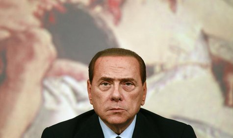 Former Italian prime minister Silvio Berlusconi looks on during a news conference at Chigi Palace in Rome August 4, 2011. REUTERS/Tony Genti Former Italian prime minister Silvio Berlusconi looks on during a news conference at Chigi Palace in Rome August 4, 2011. REUTERS/Tony Genti