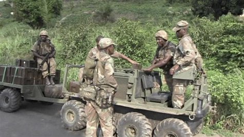 Armed South African soldiers talk in Begoua, 17 km (10 miles) from capital Bangui, in this still image taken from video, March 23, 2013. REU Armed South African soldiers talk in Begoua, 17 km (10 miles) from capital Bangui, in this still image taken from video, March 23, 2013. REU