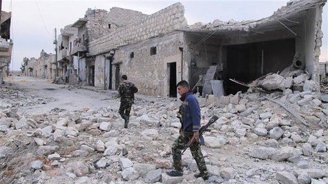 Free Syrian Army fighters carry weapons while walking down a debris-filled street in Aleppo March 19, 2013. Picture taken March 19, 2013. RE Free Syrian Army fighters carry weapons while walking down a debris-filled street in Aleppo March 19, 2013. Picture taken March 19, 2013. RE