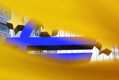 A structure of the Euro currency sign is seen through a sunflower in front of the European Central Bank (ECB) headquarters in Frankfurt July A structure of the Euro currency sign is seen through a sunflower in front of the European Central Bank (ECB) headquarters in Frankfurt July