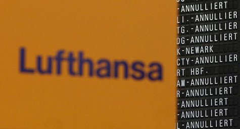The Logo of German air carrier Lufthansa is pictured next to a departure board during a five-hour warning strike, following a pay dispute, r The Logo of German air carrier Lufthansa is pictured next to a departure board during a five-hour warning strike, following a pay dispute, r