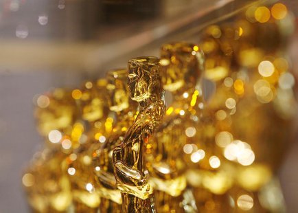 A line of Oscar statuettes can be seen at a "Meet The Oscars" display in Times Square, New York February 15, 2008. REUTERS/Lucas Jackson A line of Oscar statuettes can be seen at a "Meet The Oscars" display in Times Square, New York February 15, 2008. REUTERS/Lucas Jackson
