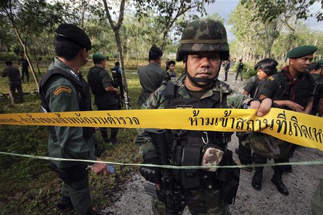 Security personnel investigate at the site of an attack on an army base near Bacho in the troubled southern province of Narathiwat February Security personnel investigate at the site of an attack on an army base near Bacho in the troubled southern province of Narathiwat February