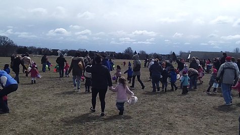 Moments after the big rush began in the playground, children and parents hunt for eggs. Moments after the big rush began in the playground, children and parents hunt for eggs.