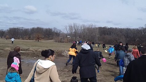 Parents wait at the starting line as their children run off into the distant clearing in the woods to hunt for Easter Eggs. Parents wait at the starting line as their children run off into the distant clearing in the woods to hunt for Easter Eggs.
