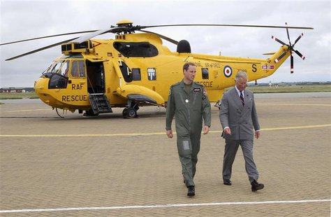 Britain's Prince Charles (R) and his son Prince William walk back to the Royal Air Force rescue base after Prince William showed his father Britain's Prince Charles (R) and his son Prince William walk back to the Royal Air Force rescue base after Prince William showed his father