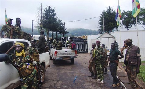 Fighters for the Seleka rebel alliance stand guard in front of the presidential palace in Bangui, Central African Republic, March, 25 2013. Fighters for the Seleka rebel alliance stand guard in front of the presidential palace in Bangui, Central African Republic, March, 25 2013.