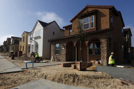 Construction workers put the finishing touches on newly built single family homes in San Diego, California March 25, 2013. REUTERS/Mike Blak Construction workers put the finishing touches on newly built single family homes in San Diego, California March 25, 2013. REUTERS/Mike Blak
