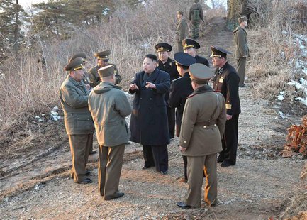 North Korean leader Kim Jong-Un (C) talks with generals as soldiers of the Korean People's Army (KPA) take part in the landing and anti-land North Korean leader Kim Jong-Un (C) talks with generals as soldiers of the Korean People's Army (KPA) take part in the landing and anti-land