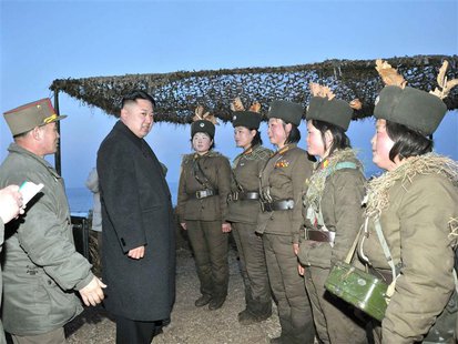 North Korean leader Kim Jong-Un (2nd L) talks with soldiers of the Korean People's Army (KPA) taking part in the landing and anti-landing dr North Korean leader Kim Jong-Un (2nd L) talks with soldiers of the Korean People's Army (KPA) taking part in the landing and anti-landing dr