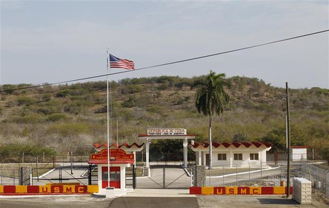 The Northeast gate marks the end of U.S. soil as the road leads into Cuba at Guantanamo Bay U.S. Naval Base, March 8, 2013. Picture taken Ma The Northeast gate marks the end of U.S. soil as the road leads into Cuba at Guantanamo Bay U.S. Naval Base, March 8, 2013. Picture taken Ma