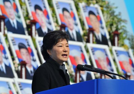 South Korea's President Park Geun-Hye speaks in front of photographs of sailors who died, during an event marking the third anniversary of t South Korea's President Park Geun-Hye speaks in front of photographs of sailors who died, during an event marking the third anniversary of t