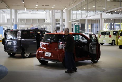 A visitor looks at Toyota Motor Corp cars at the company's showroom in Tokyo February 5, 2013. REUTERS/Toru Hanai A visitor looks at Toyota Motor Corp cars at the company's showroom in Tokyo February 5, 2013. REUTERS/Toru Hanai